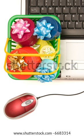 shopping basket full of gifts and notebook isolated on white