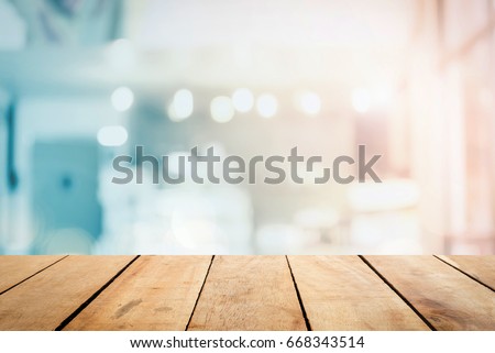 Abstract Front blur wood texture table bar view on clean terrace office window background content for christmas breakfast scene, modern interior grocery shop summer light blue pastel color photography Royalty-Free Stock Photo #668343514