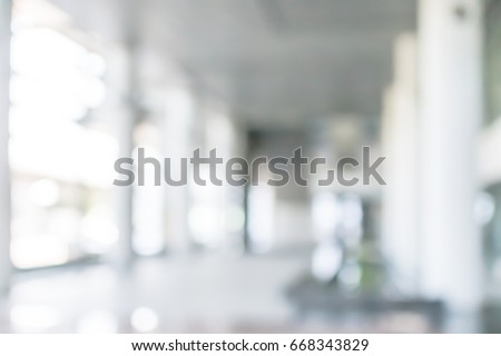 Business building blur background office lobby hall interior empty indoor room with blurry light from glass wall window