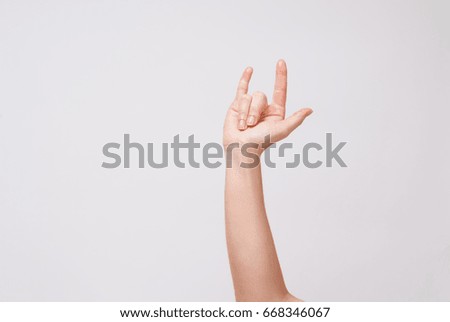 Sign with the hand and fingers on a withe background 