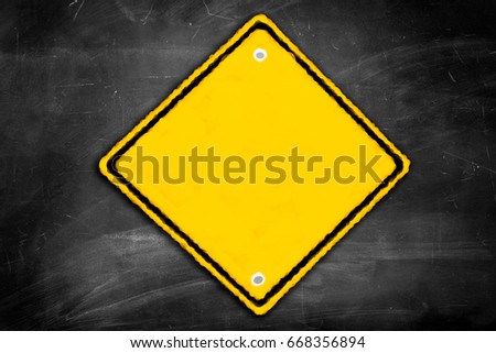 blank  caution sign on a black chalkboard with room for print