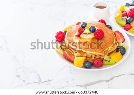 pancake with mix fruits (strawberry, blueberries, raspberries, mango, kiwi)