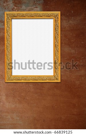 Gold frame on old wall