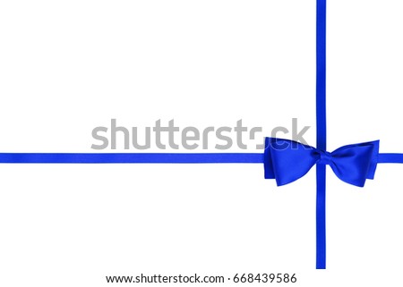 Single blue gift bow and cross silk ribbon on white background