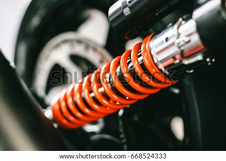 Closeup of springs, shock absorbers motorcycle big bike. Rad shock Absorbers motorcycle . focus on suspension. Royalty-Free Stock Photo #668524333