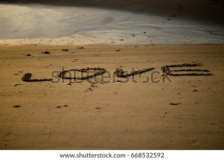 Love letters on the sand
