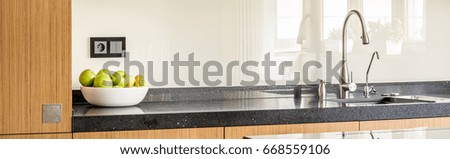 Worktop of modernly designed bright kitchen interior