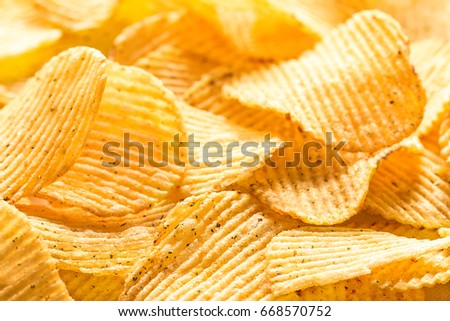 Potato chips texture background. Potatoes pattern.. Chips texture studio photo
