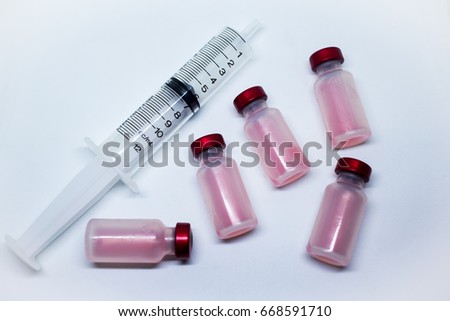 the vaccine and a hypodermic syringe  , Medicine isolated plastic vaccination equipment with needle on white background
