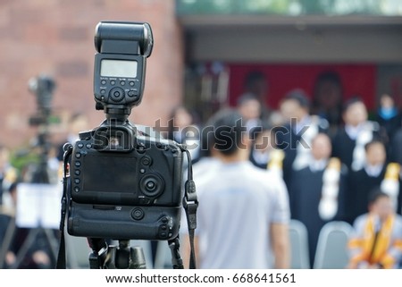 Camera on tripod and flash Graduation blur photo