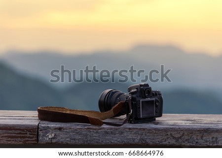 Travel photographer equipment with beautiful landscape on the background, Traveling and Relax Concept.