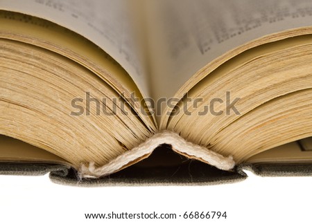 Opened old book isolated on white