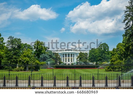 Picture from outside the fence of White House. The White House in Washington DC, is the home and residence of the President of the United States of America and popular tourist attraction in summer day