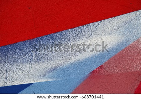 Street art. Colorful graffiti on the wall. Fragment for background. Abstract graffiti on the wall. Vivid red color
