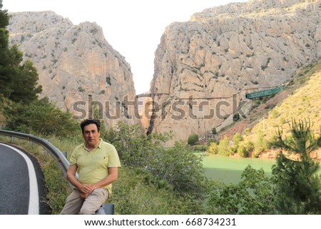 Man posing in the gorge of Los Gaitanes, Caminito del Rey, Malaga, Spain