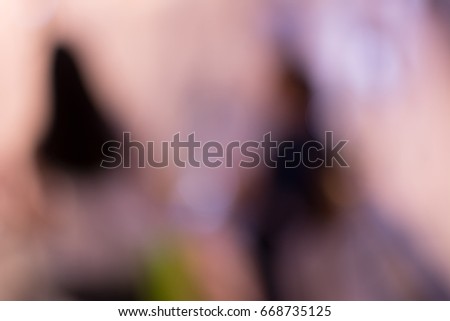 Abstract and blurred background : two people  take the escalator  down to first floor 