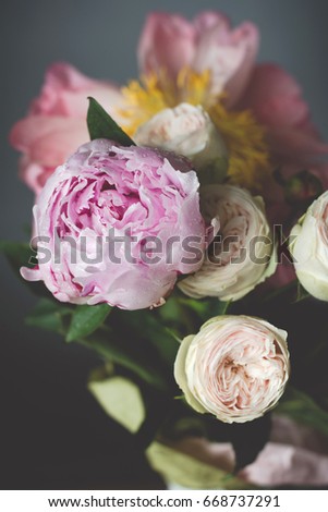 Peonies and roses bouquet. Shabby chic pastel colored wedding bouquet. Closeup view, selective focus