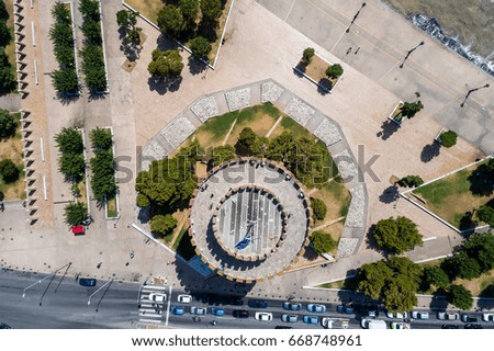 Aerial photography of the famous white tower in the city of Thessaloniki in northern Greece. Image taken with action drone camera