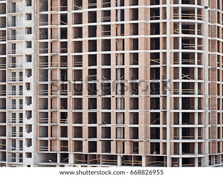 Monolithic frame construction on facade - building under construction.
