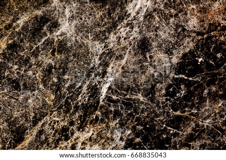 Detailed structure of real genuine marble from nature with gold and black patterned texture background of Thailand for background,interiors,skin tile luxurious and design. Picture high resolution.