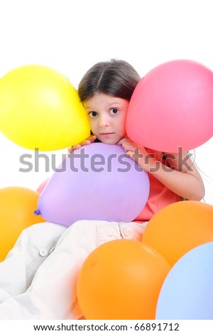 Surprised little girl with balloons. Isolated on white background