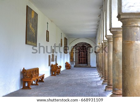 Corridors, columns and benches of the interior patios of the San Francisco church, in Quito, Ecuador