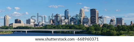 DOWNTOWN SKYLINE MINNEAPOLIS MINNESOTA and  MISSISSIPPI RIVER USA  Royalty-Free Stock Photo #668960371
