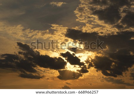 Golden Sun Setting Behind the Clouds