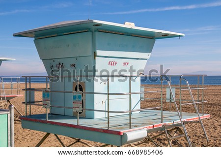 Exterior of blue lifeguard hut on shore at beach