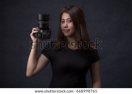Portrait of happy young woman asian at studio, Young girl photographer concept