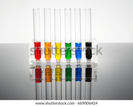 Laboratory test tubes are located in the rack