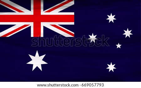 Realistic flag of Australia on the wavy surface of fabric. This flag can be used in design