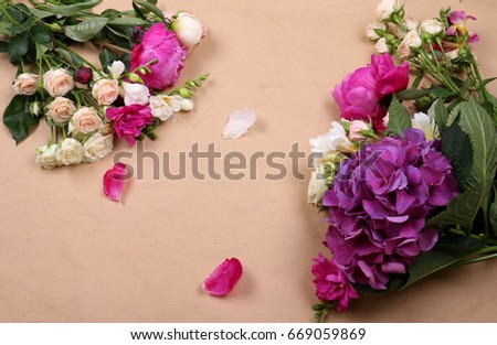 A frame from flowers in white-violet tones a kind from top. Ponds of a freesia hydrangeas And bush roses
