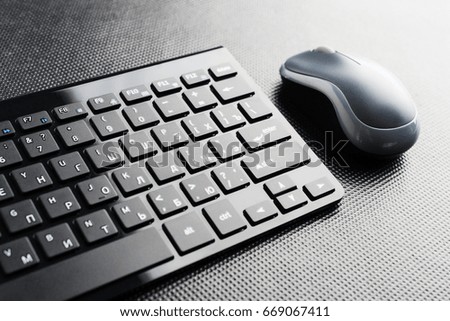 keyboard and mouse on the table .