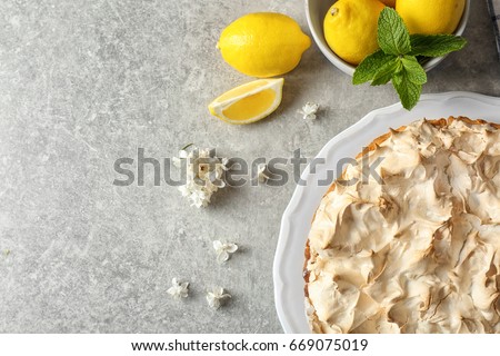 Composition with tasty lemon meringue pie on grey table, closeup