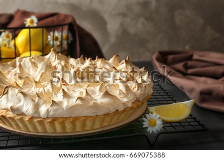 Tasty lemon meringue pie on kitchen table, closeup