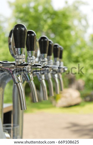 Wine taps in the row, wine tasting outside the winery 