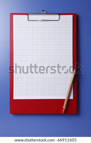 Red clipboard isolated on the blue background.