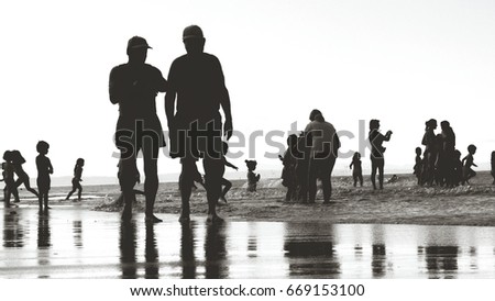 Beach silhouette people at seaside
