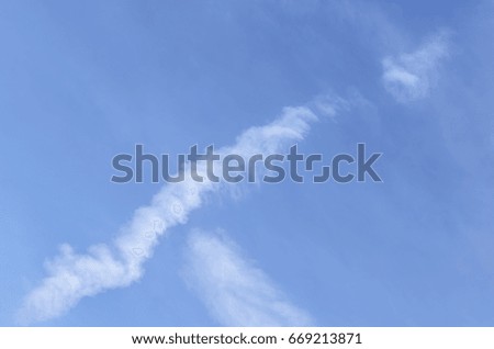 cloud and traces of aircraft