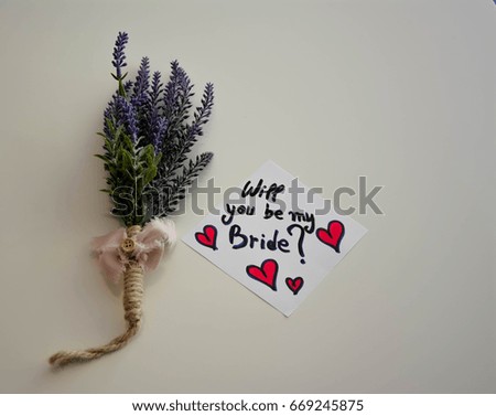 Lavender flower and will you be my bride text on a note