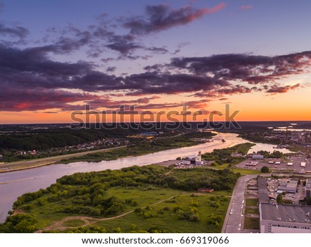 Aerial view of Kaunas with sunset above Nemunas river