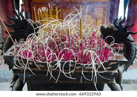Incense burning Embossed in an ancient dragon pot. There is a lot of smoke.Use to pay respect to the Buddha in Buddhism life and Chinese tradition.

