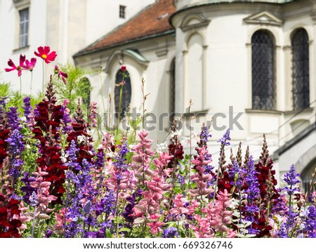 Greeting Card with colorful flower and church. Beautiful summer flowers.