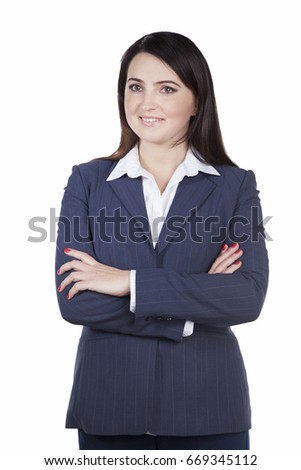 Attractive young businesswoman in business jacket smiling looking away. Crossed her arms over her chest standing on white background