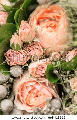 Beautiful fragment of a bouquet of flowers with roses, top view.
