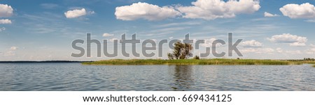 Panoramic landscape of island in a river. 