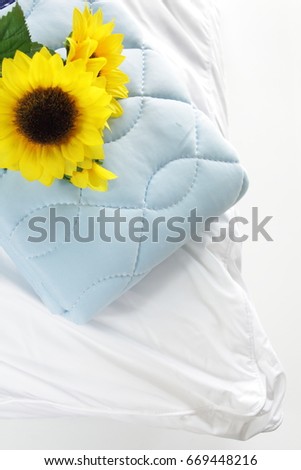 Summer cooler pad on pillow with artificial sun flower for summer interior image