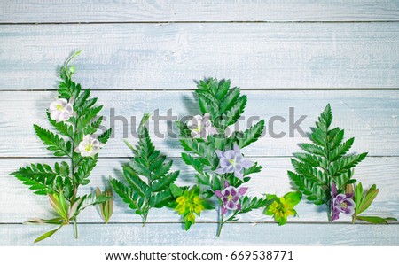 Flower pattern on a blue wooden background