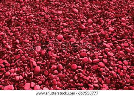 Amaranth colored stones of the beach of Aphrodite. Souvenirs as a gift. The rock of the Greek (Petra tou Romiou). Paphos region. Cyprus island. Background